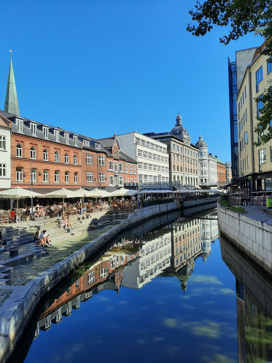 a river running through a city next to tall buildings